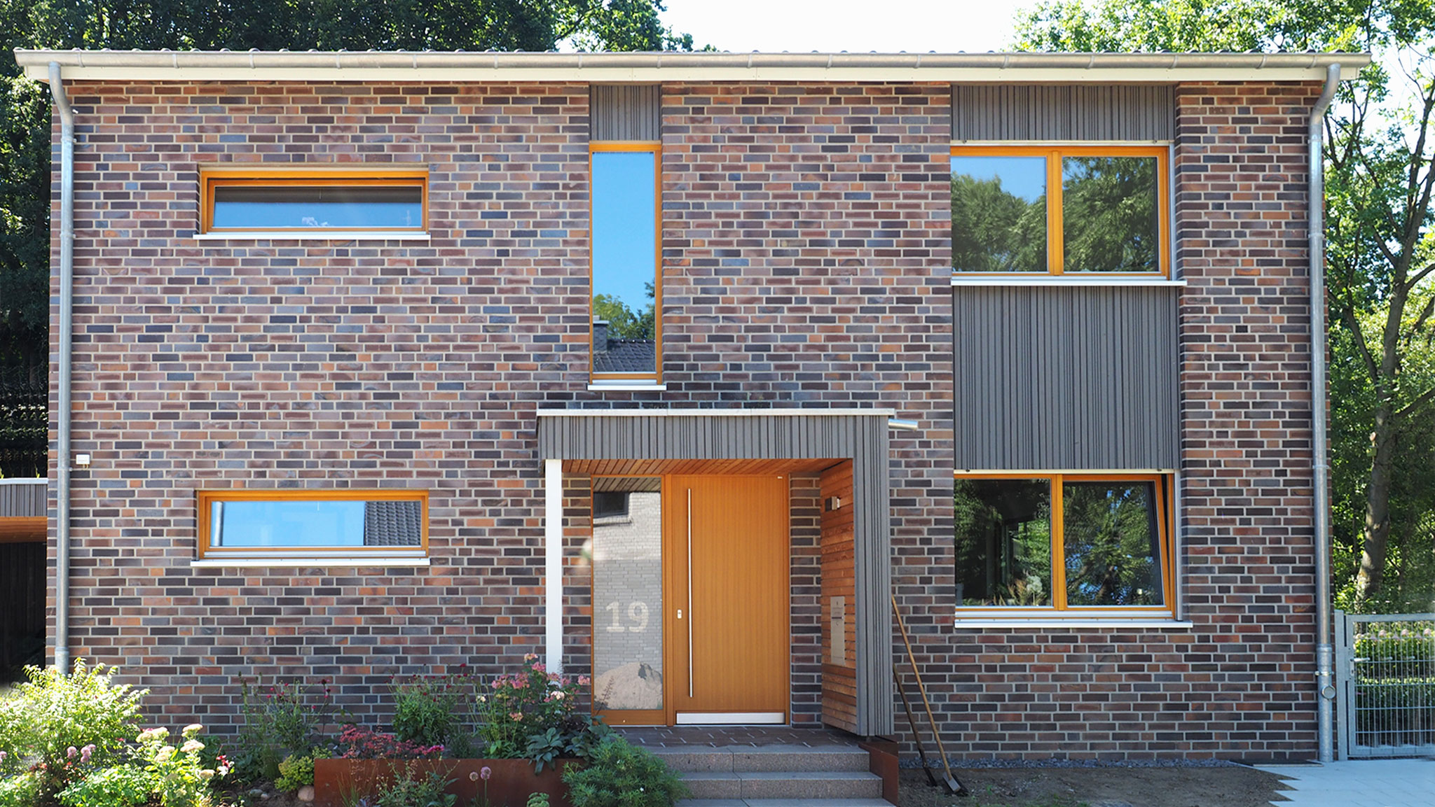 Einfamilienhaus in Marl mit Klinkerfassade und Holzfassaden